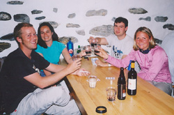 Harry, Arlette, Alex, and Kate are working on two bottles of wine. 