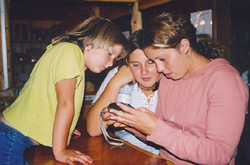 Michelle, Nicole, and Alana are busy checking out how the picture came out. No worries, mates :)